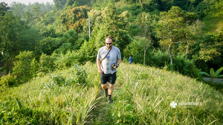 Toutist visiting the tea plantations of Sreemangal with Nijhoom Tours