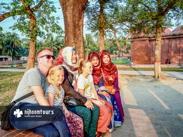 Taking photo with the locals at Bagerhat in Bangladesh