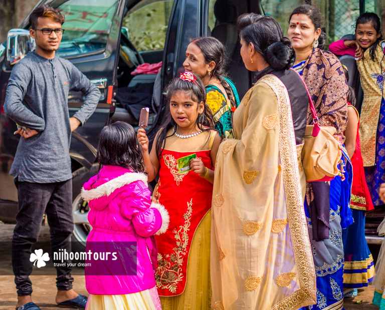 A Bangladeshi family on holiday in colorful outfits