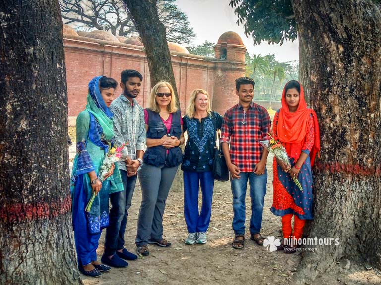 Taking photo with the locals at Bagerhat in Bangladesh