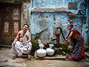 A photo of a woman filling water jars at Old Dhaka in Dhaka (West) Photography Tour